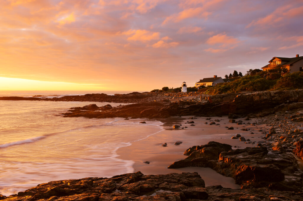 Gorgeous sunrise on a beach and rocky coastline of Maine, USA
